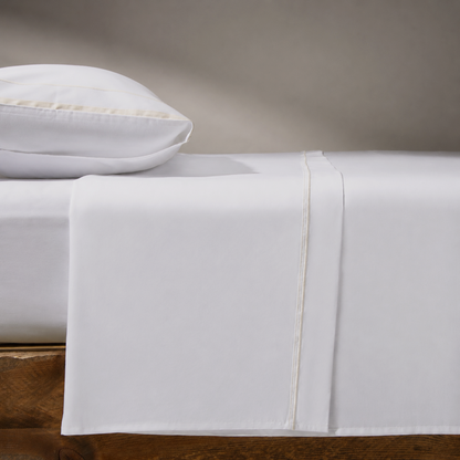 Heaven 800 thread count sateen flat sheet on bed