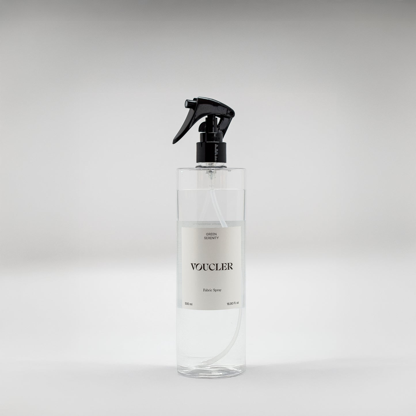 Image of the Green Serenity fabric spray from Voucler, with a transparent packaging and white label.
