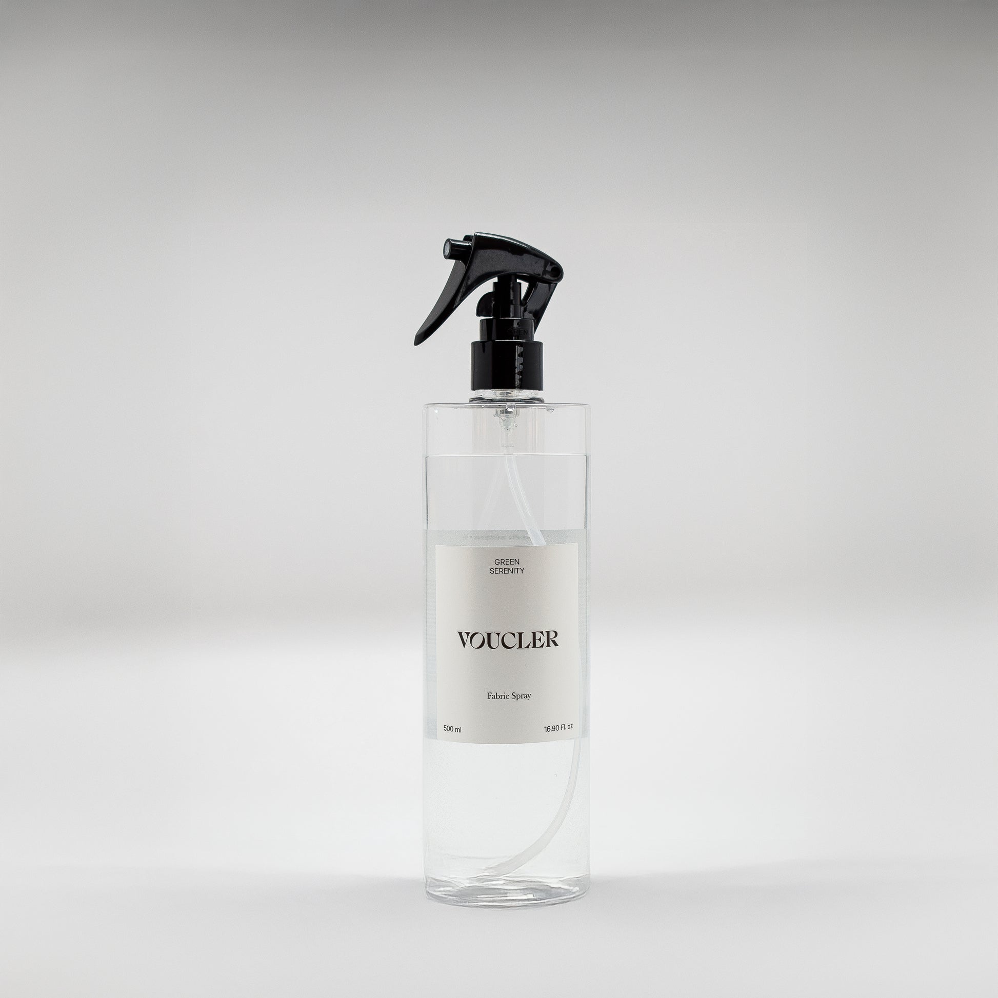 Image of the Green Serenity fabric spray from Voucler, with a transparent packaging and white label.