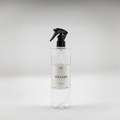 Image of the Green Serenity fabric spray from Voucler, with a transparent packaging and white label.