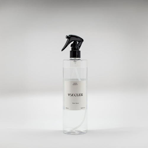 Image of the Green Serenity fabric spray from Voucler, with a transparent packaging and white label.
