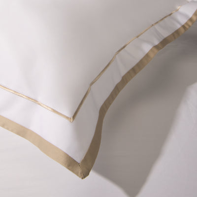 Detail of the golden stripes on the Heaven Sateen pillowcases.