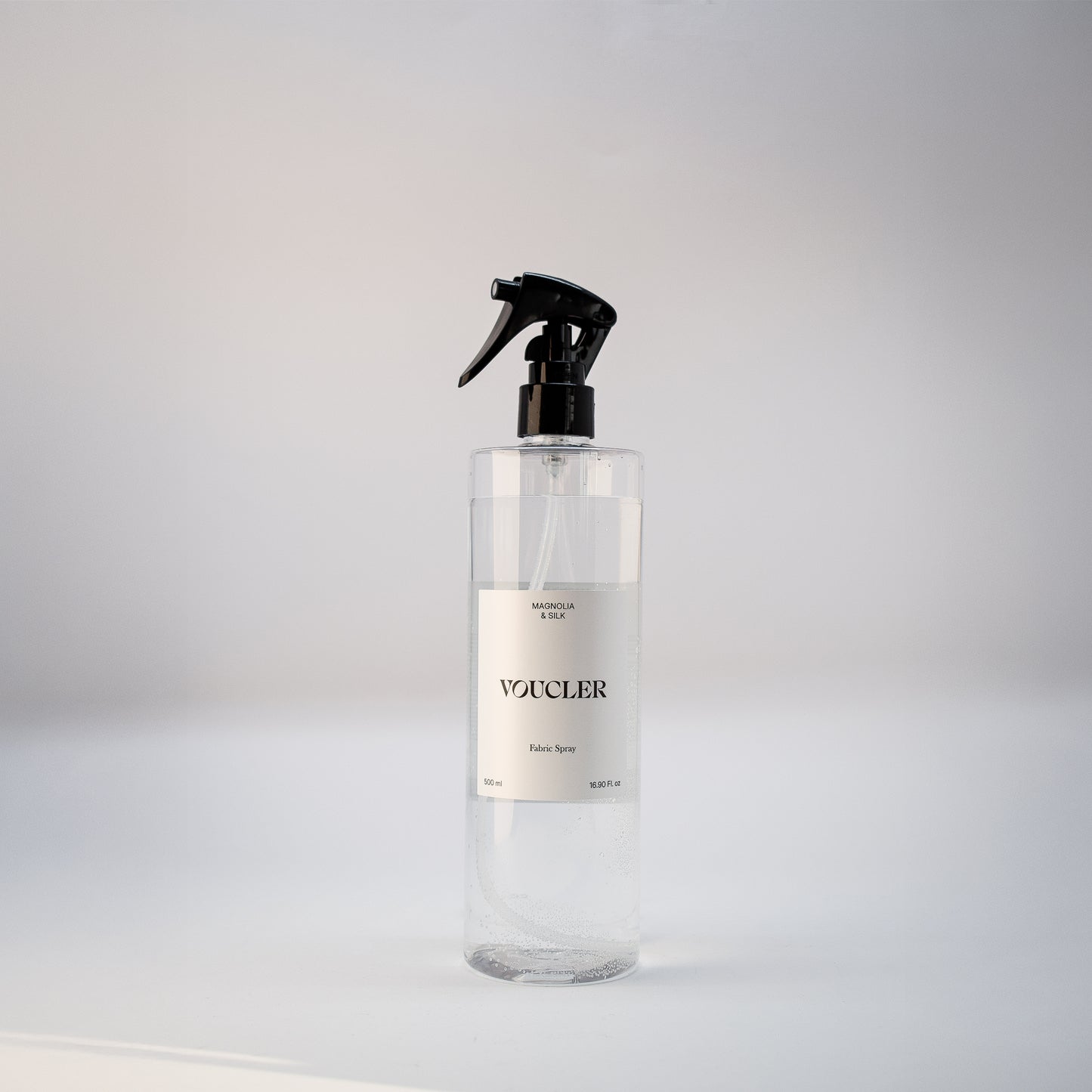 Image the Magnolia Silk of fabric spray from Voucler, with a transparent packaging and white label.