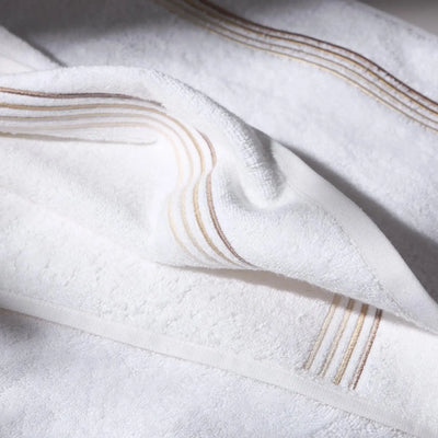 Detailed image of a beige towel, conveying a feeling of cleanliness and hygiene care.