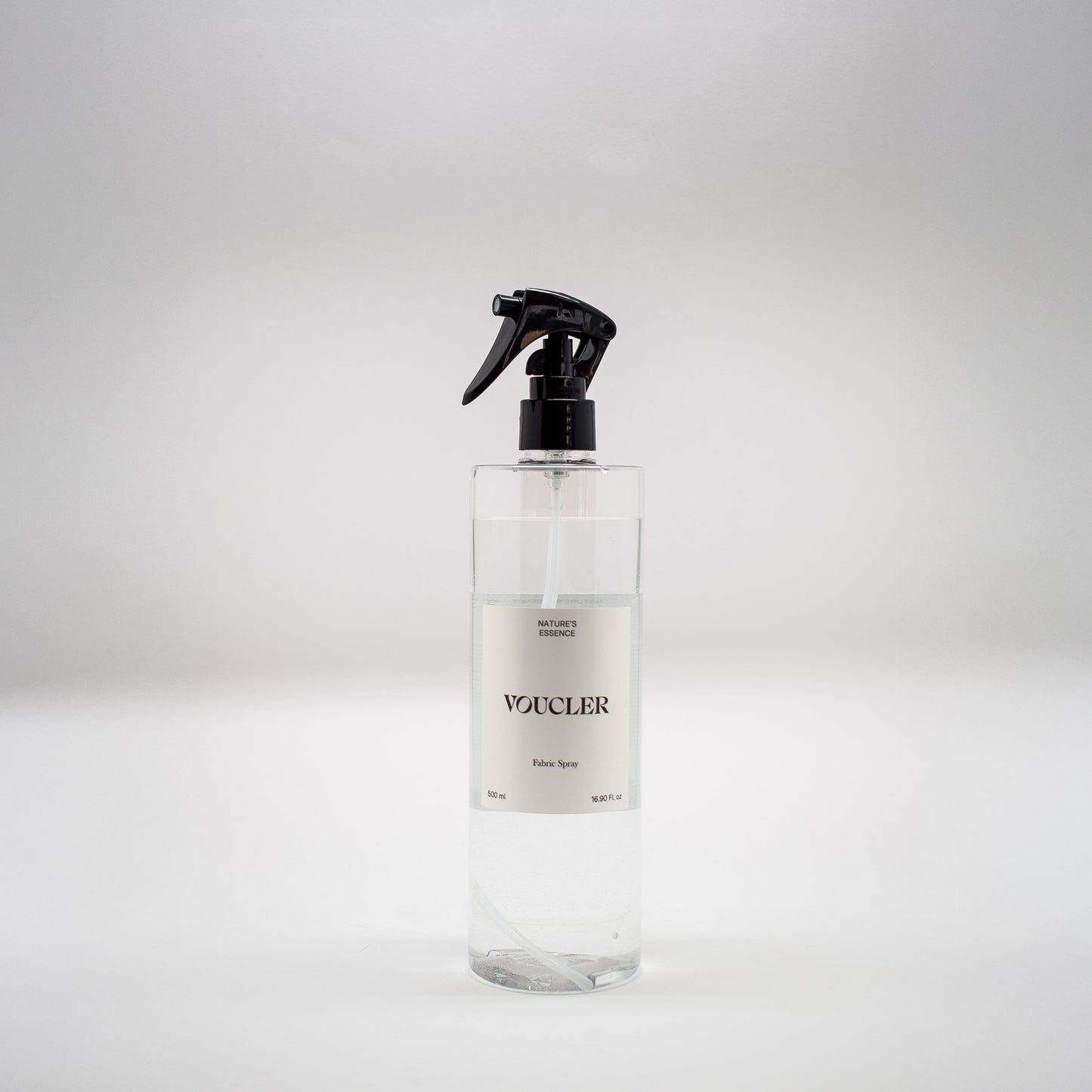 Image of the Nature Essence fabric spray from Voucler, with a transparent packaging and white label.
