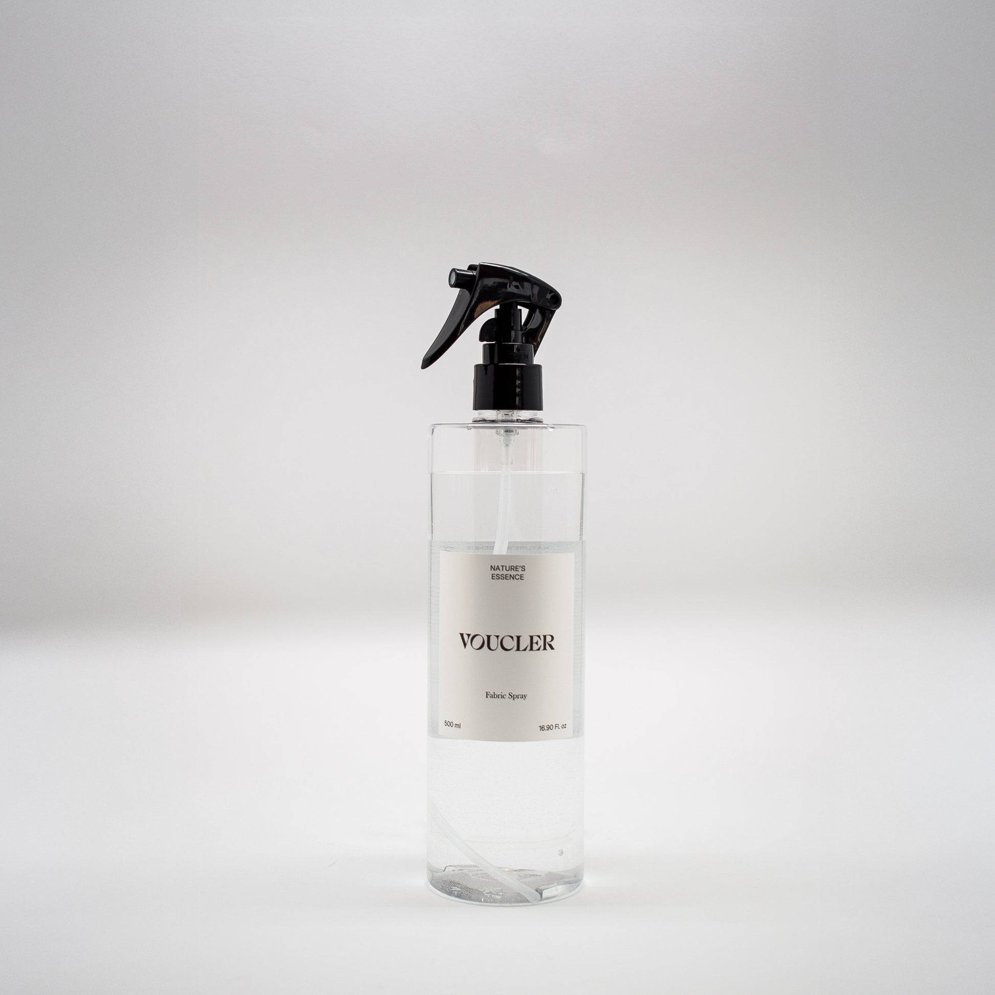 Image of the Nature Essence fabric spray from Voucler, with a transparent packaging and white label.