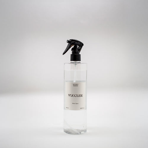Image of the Nature Essence fabric spray from Voucler, with a transparent packaging and white label.