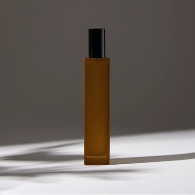 Natural essence room spray with a dark rectangular bottle and black cap, creating an elegant and minimalist look.