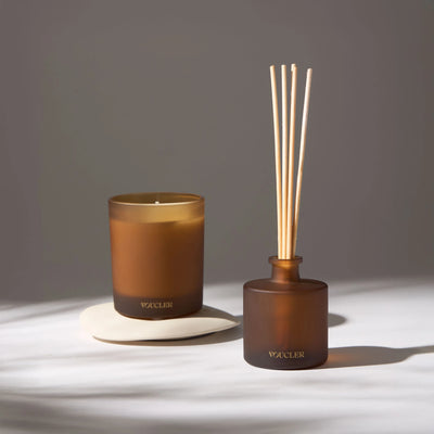 Voucler scented candle and room diffuser in a dark amber tone, ideal for creating a relaxing and elegant atmosphere in your space.