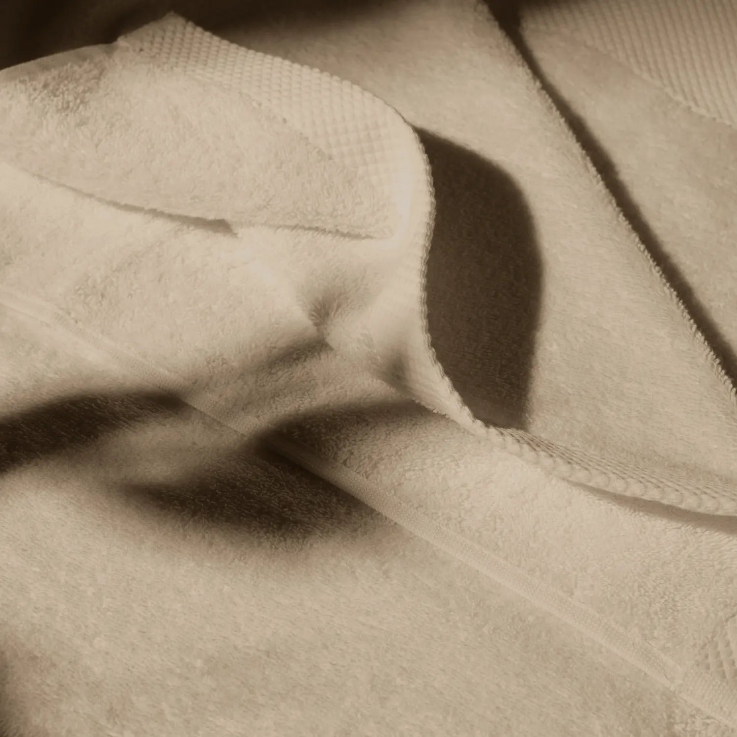 Detailed image of a beige towel, conveying a feeling of cleanliness and hygiene care.