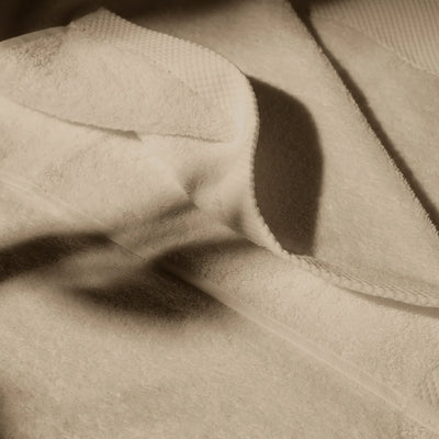 Detailed image of a beige towel, conveying a feeling of cleanliness and hygiene care.