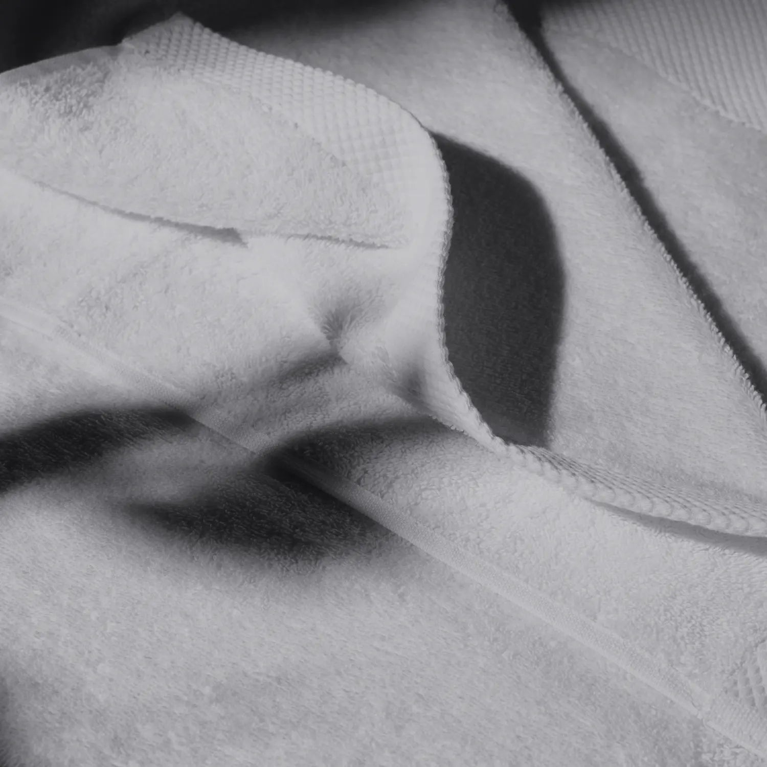 Detailed image of a gray towel, conveying a feeling of cleanliness and hygiene care.