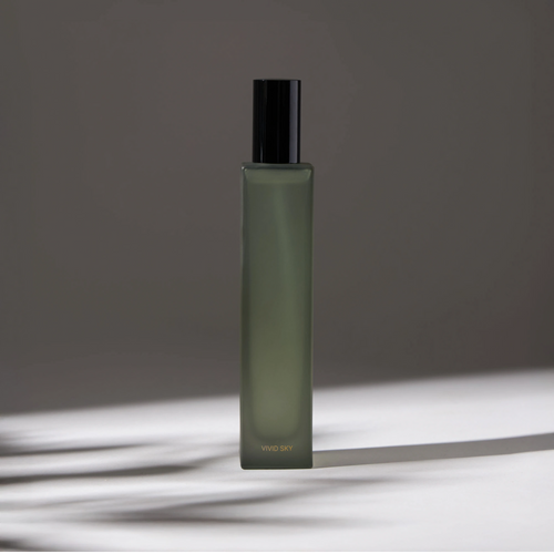 Voucler room spray bottle in green with a black cap, highlighting the minimalist packaging on a neutral background.